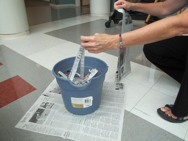 Figure 3. Tear newspapers into 1/2-inch wide strips for bedding.